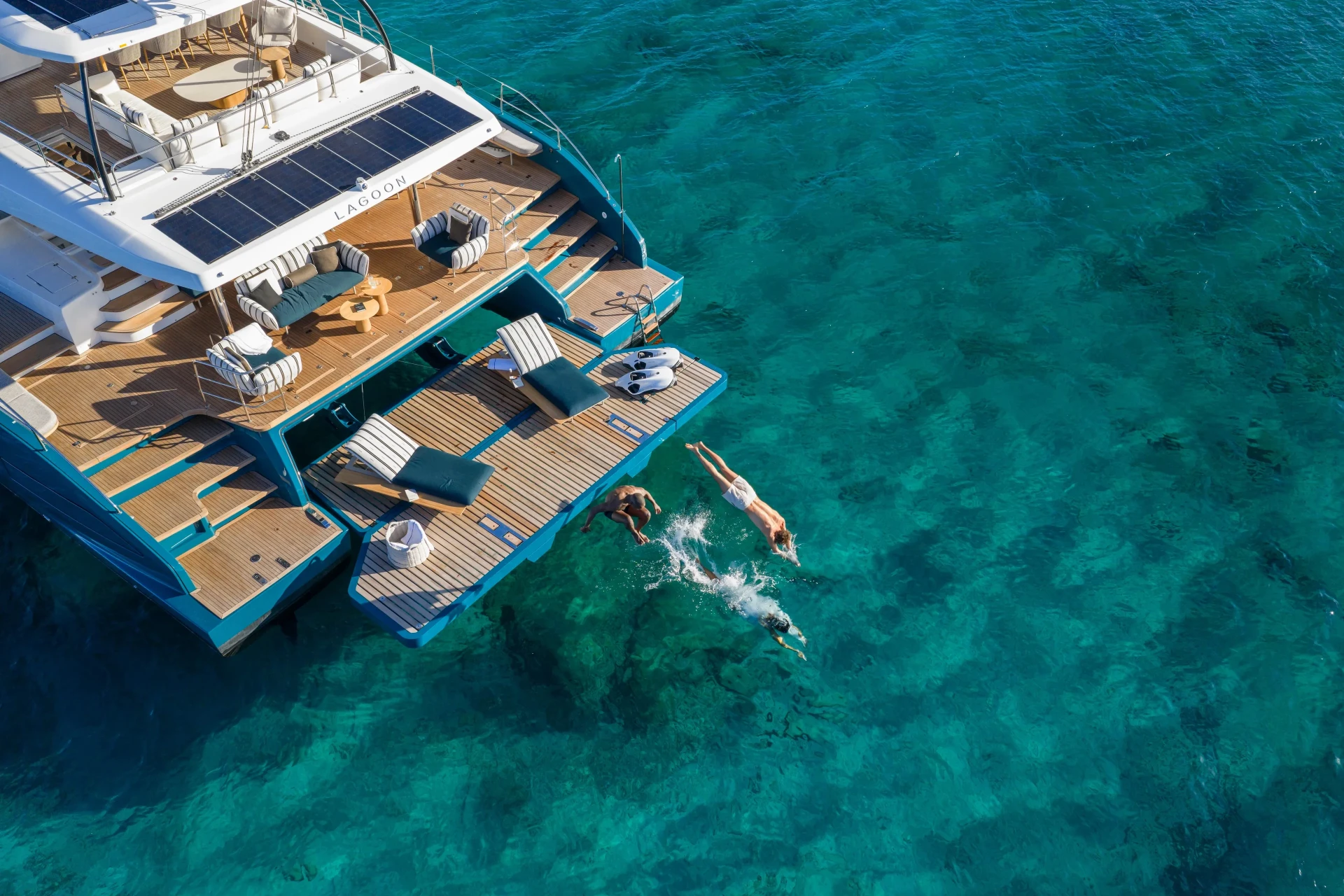 Lagoon Eighty2 cockpit lounge with teak decking and open ocean views